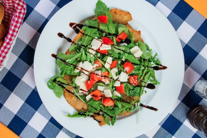 Schweinsschnitzel Rucola - Schnitzelhuus
