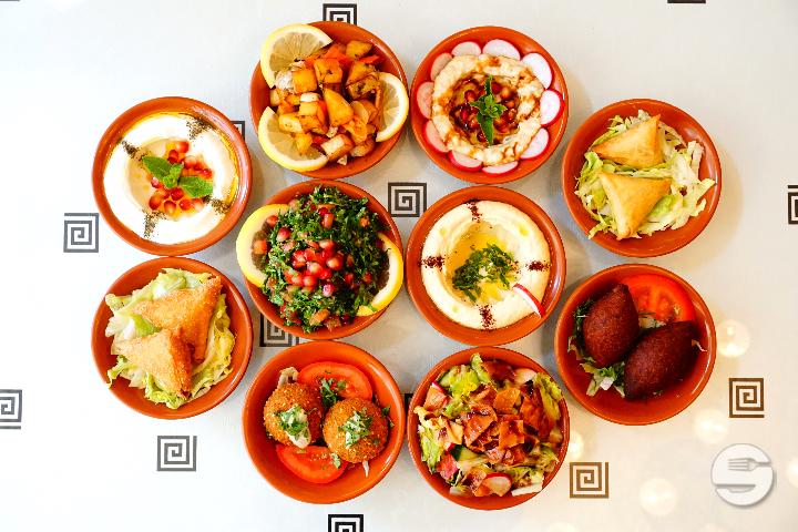 30. Different bowls with warm and cold mezze - Tassnim Orient
