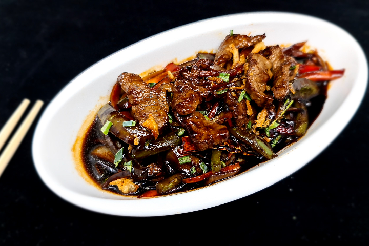 43. Sliced Caramelized Pork and Shallots - L'indochine