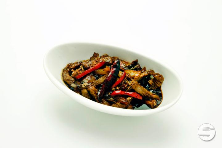 43. Sliced caramelized pork and shallots - L'indochine