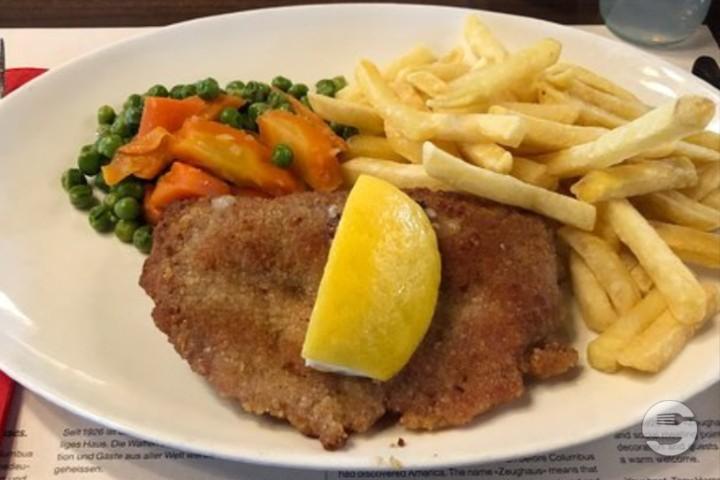 Fried pork schnitzel with French fries and vegetables - Ali Baba