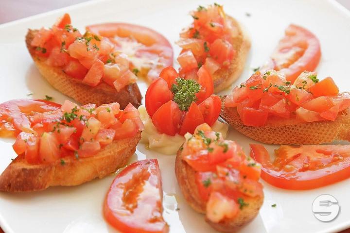 Italian Bruschetta with Tomatoes and Cured Ham - Restaurant de La Patinoire