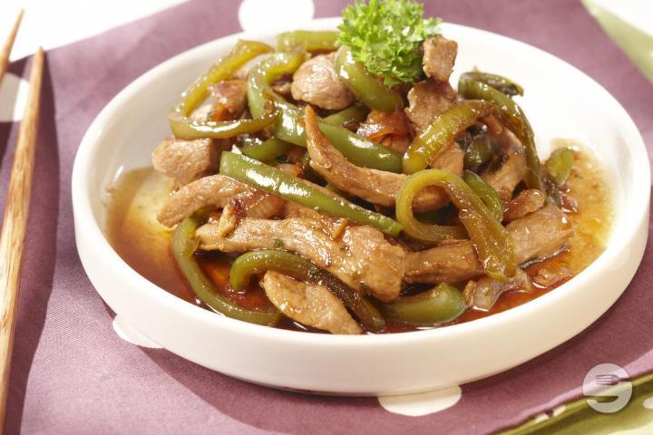 230. Pork in Black Pepper Sauce Served on Slate - Le Lotus