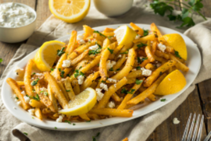 Portion of French fries with tzatziki - Spyros Gyros